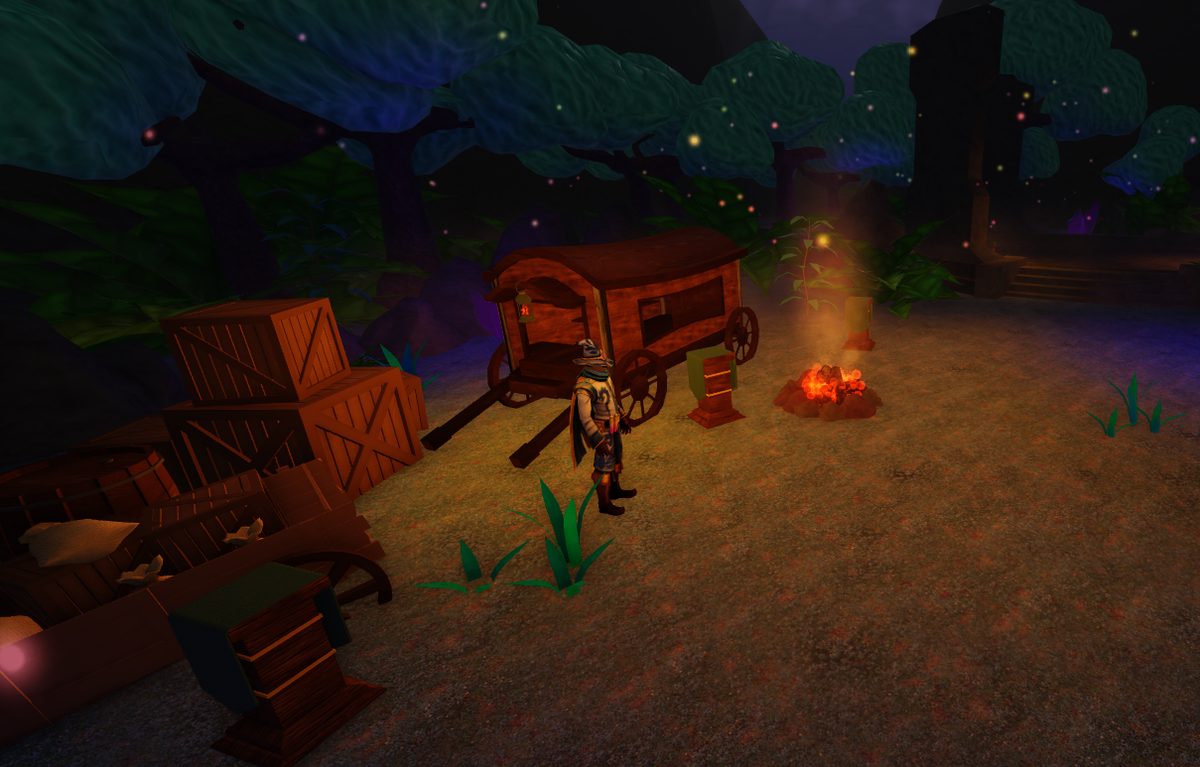 Traveller beside a wagon and campfire at night