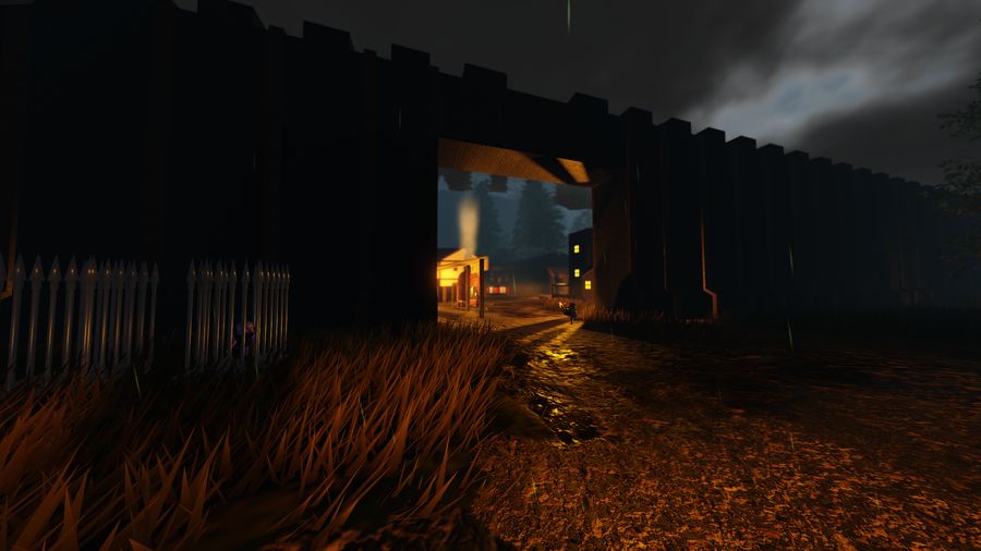 The settlement gate at night, seen from the road outside